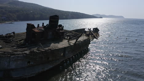 abandoned wooden shipwreck on the coast