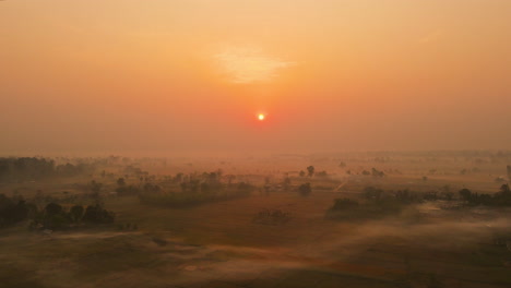 Witness-the-magical-winter-sunrise-at-Plain-Terai-in-Bardiya,-Nepal-through-this-stunning-drone-footage