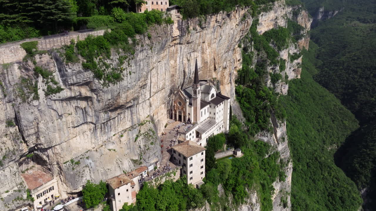 Historic Mountainside Church Of Madonna della Corona In Monte Baldo In Verona, Italy. - aerial shot