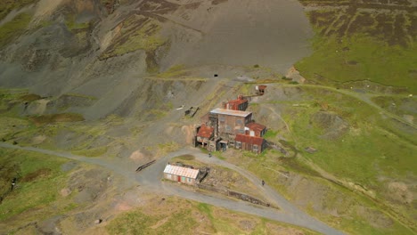 abandoned rusty industrial buildings at disused force crag mine coledale beck in the english lake district