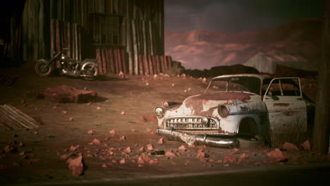 coche abandonado y motocicleta en un desierto