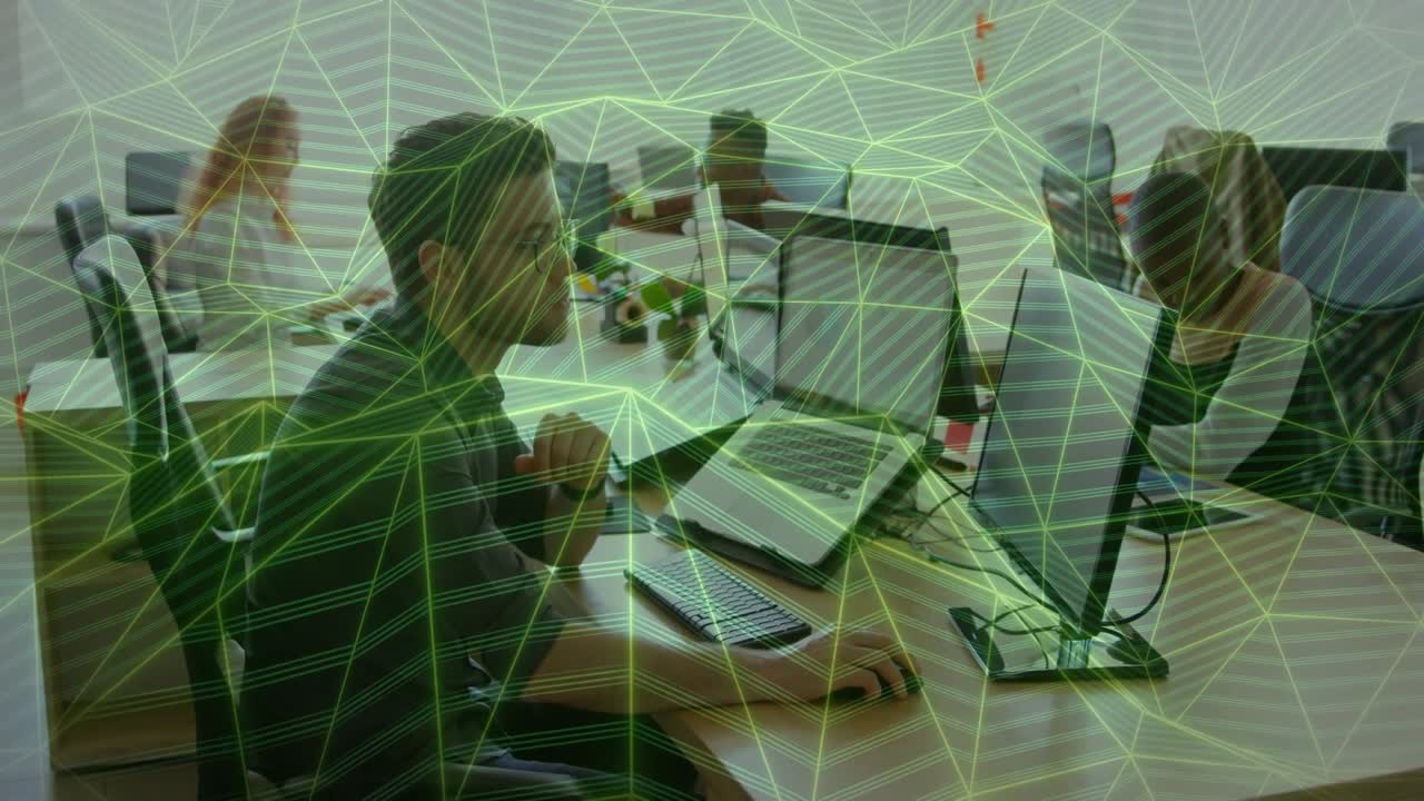 software engineer typing on PC in open-plan office, showing animated code graph overlays