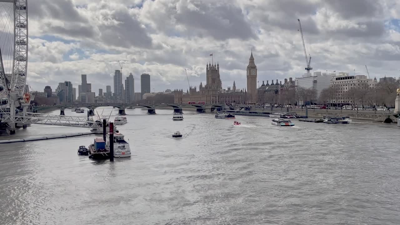 Looking up the river towards Big Ben and the London Eye from Hungerford Bridge