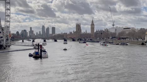 looking up the river towards big ben and the london eye from hungerford bridge