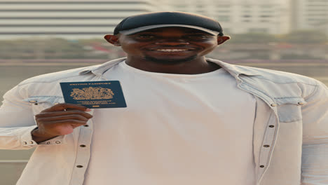man holding a british passport