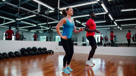 couple exercising in a gym