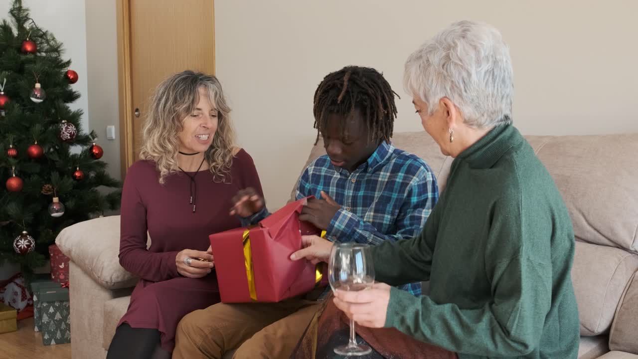 A family opening presents on Christmas