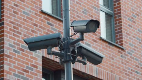 polygonal closed-loop camera of a video surveillance system , a street security surveillance camera installed on the street against a residential building