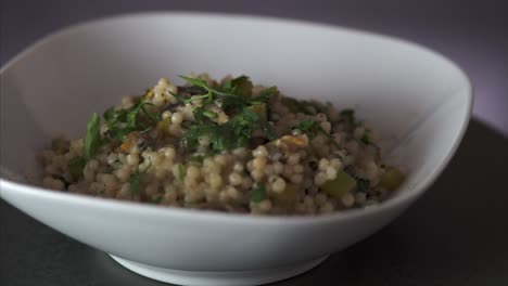 Rotating-steamy-plate-of-vegetarian-Couscous