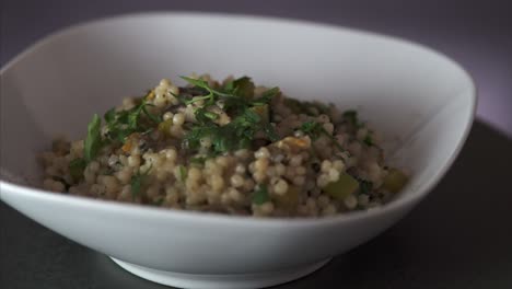 rotating steamy plate of vegetarian couscous