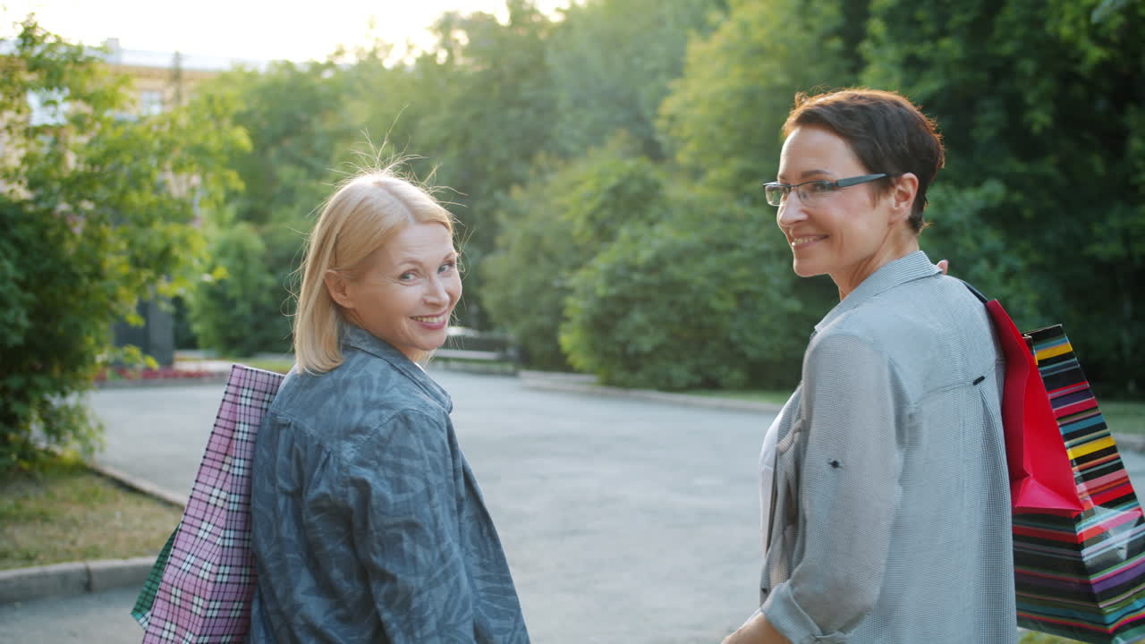 Two women shopping in a park