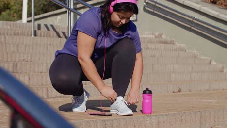 young runner tying his shoelaces