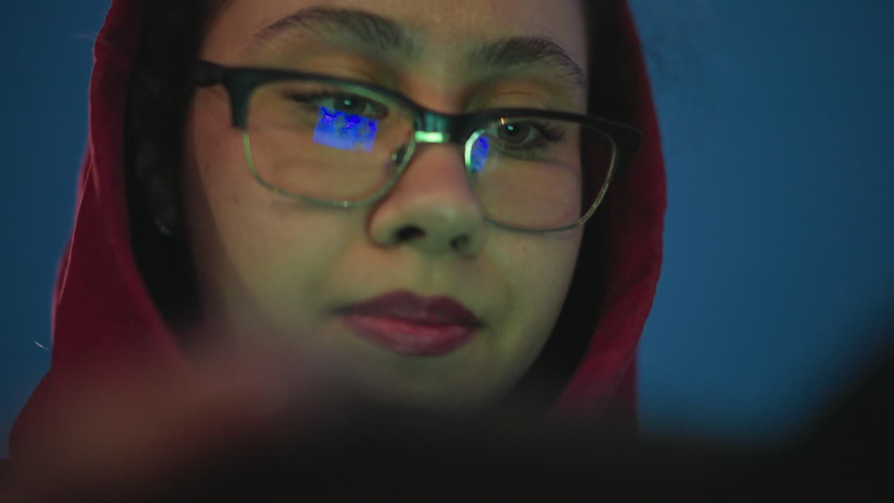 Quiet Nighttime Scene With Focused Woman, Calm Nocturnal Moment Featuring Woman In Most Vivid Attire, Tranquil Late Night Setting Showing Woman Examining Screen With Steady Concentration