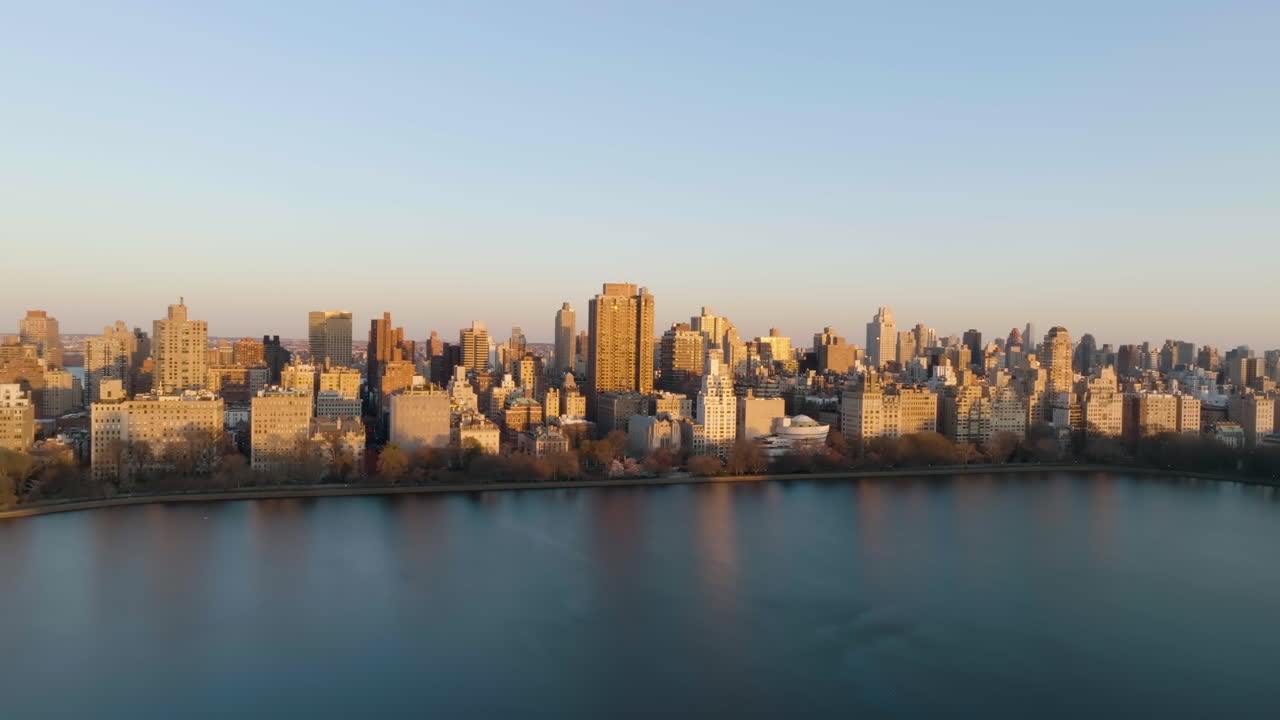 Aerial view of the Upper East Side cityscape, golden hour in New York, USA - tracking, drone shot
