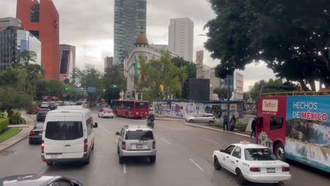 Slow motion shot of traffic near glorieta de las mujeres que luchan in mexico city