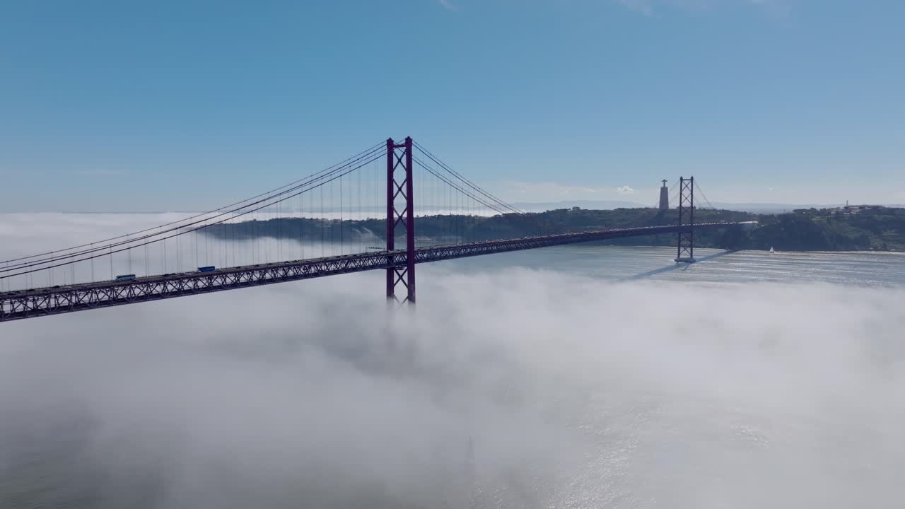 Drone shot of the fog and the bridge in Lisbon.