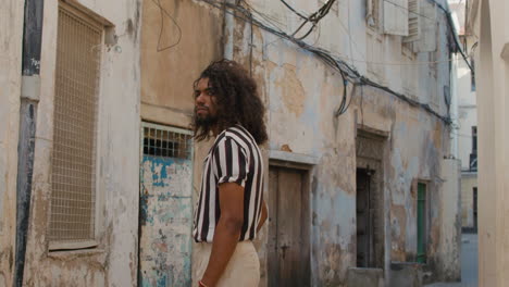 young black mix arabic race man wonders in the street of old town