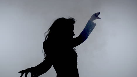 Dancing-woman-silhouette-on-smoke