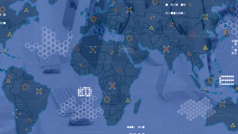 animation of circuit board pattern over map and geometric shapes against computer on desk in office