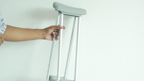 person holding crutches