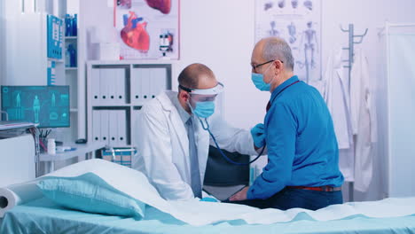 doctor listening heart of senior patient