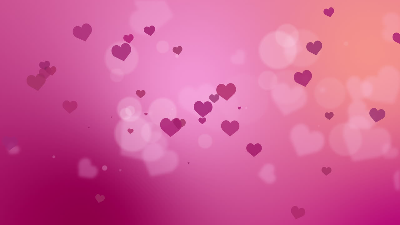 Soft blurred background with bokeh and heart shapes. Wedding romantic abstract background with pink and red hues.