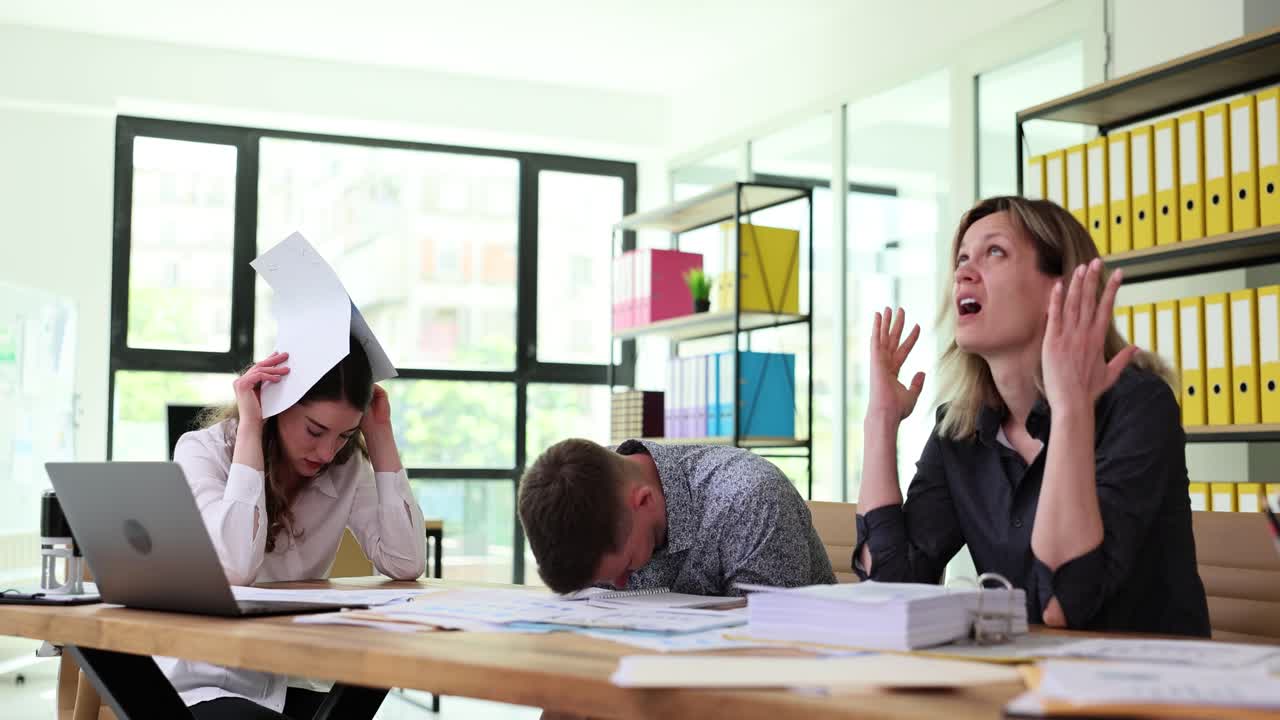 Overwhelmed Business Team Struggling with Work Stress in Office ...