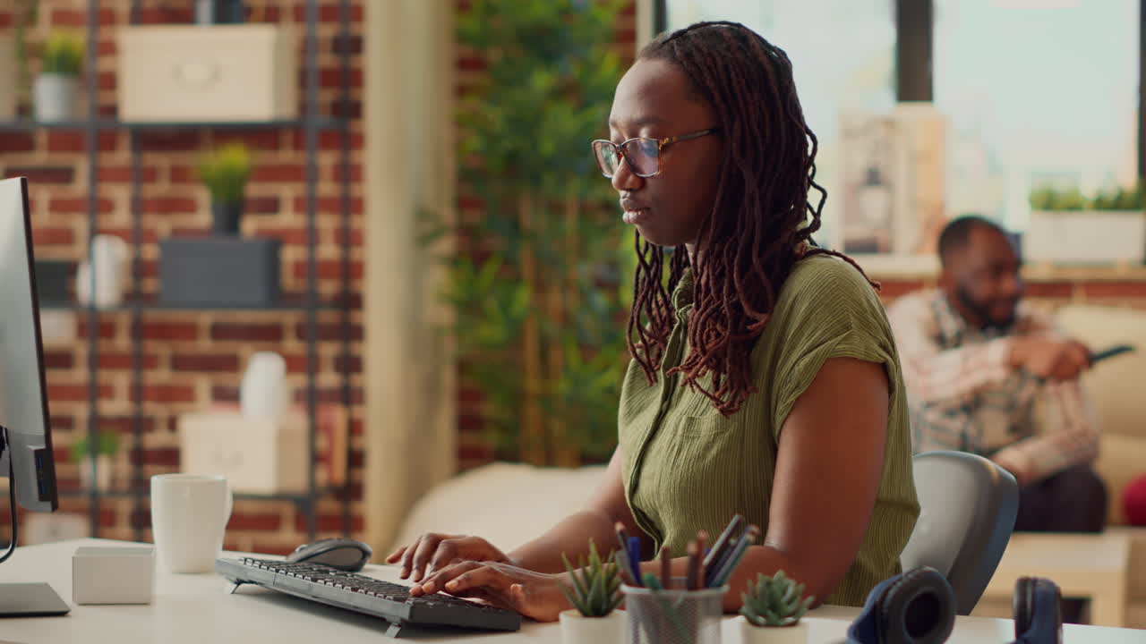 Office employee using computer to work on company report