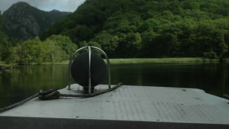 PoV-Shot-of-a-Small-Motor-Boat-Cruising-on-a-Beautiful-Fjord-in-South-of-Norway,-Close-Up-of-a-Boat-Indication-Lamp-on-the-Bow,-Beautiful-Weather-on-a-Fishing-Boat