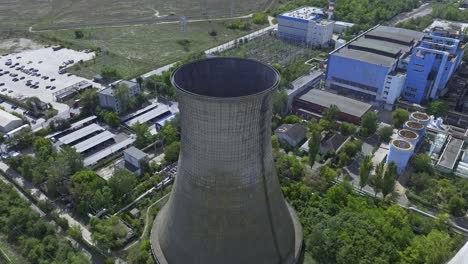 great high angle perspective of natural draft cooling tower - aerial fly over