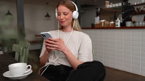 pleased woman typing by phone