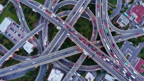 aerial view of a complex highway interchange with moving traffic