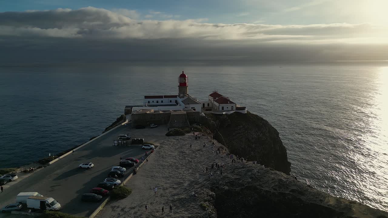 Silver sunset aerial orbits lighthouse on Cape St Vincent in Portugal