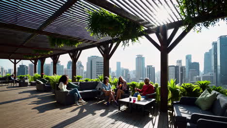 friends relaxing on rooftop patio with city view
