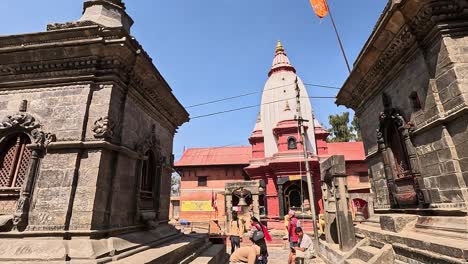 pashupatinath temple shivalayas at mrigasthali mausoleums under trees and blue sky. kathmandu, nepal