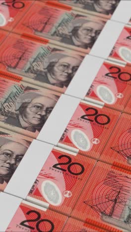 vertical video of 20 australlian dollar banknotes printed by a money press