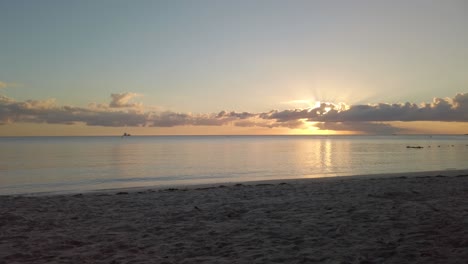 a slow panning of the sunset in a tropical beach