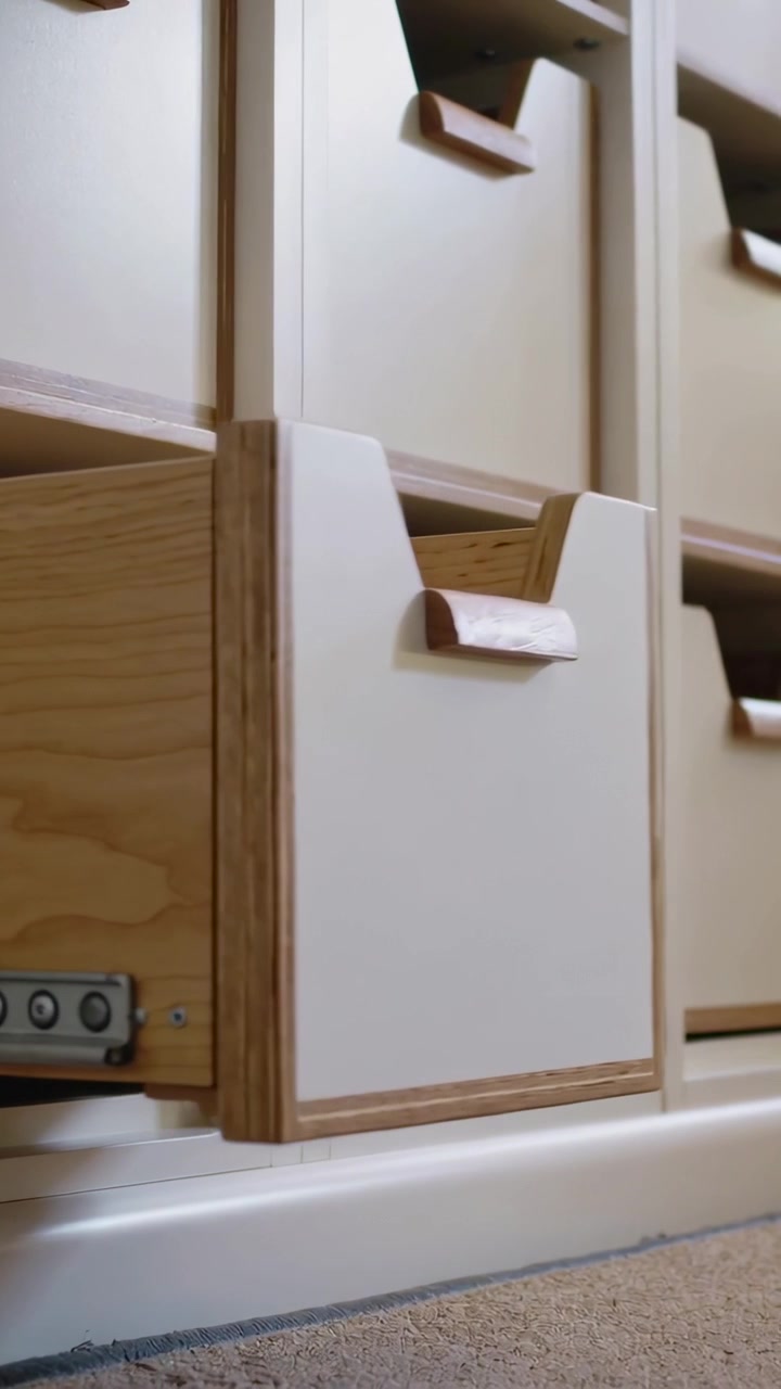 Vertical video: Pulling drawer outward in room on carpet for exposing plywood side and metal slide