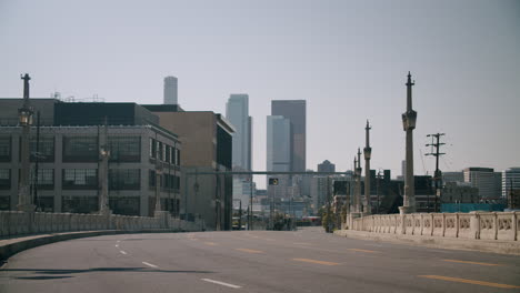 empty urban bridge leading to city skyline