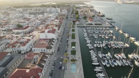 flyover vila real de santo antonio promenade, waterfront marina with sailing boats moored, algarve