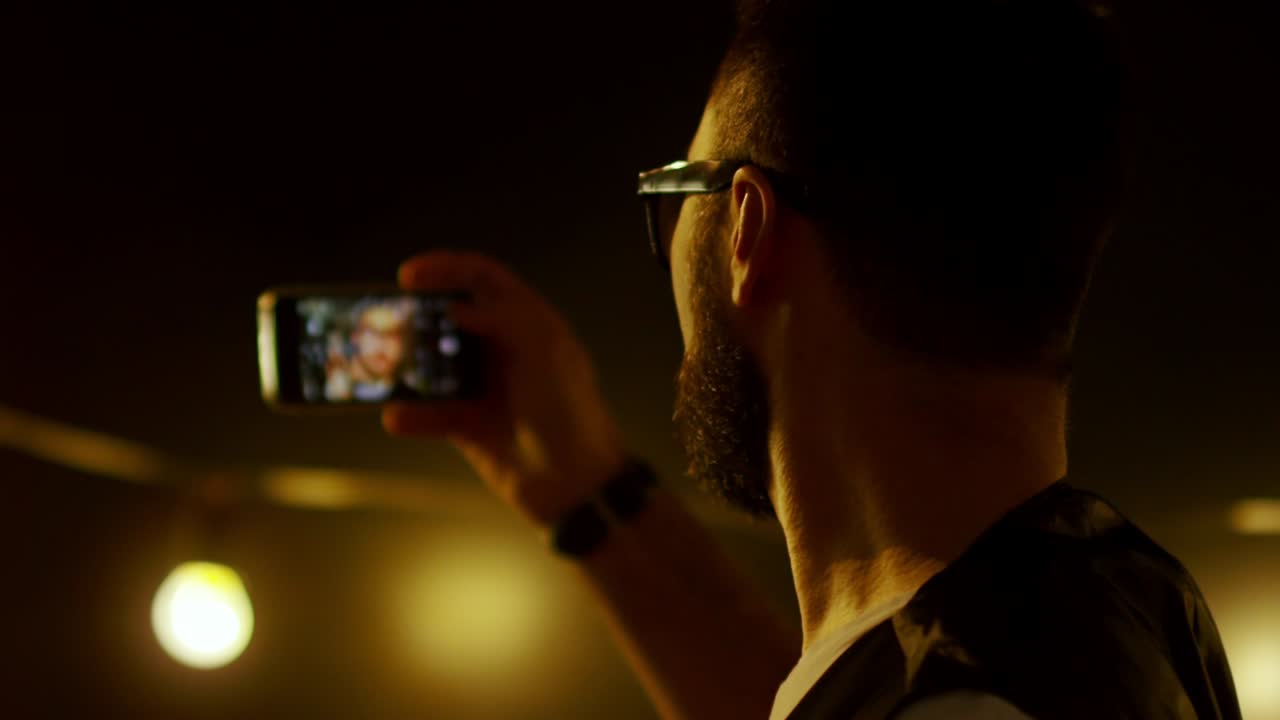 Man Taking Selfie at Nightclub Party