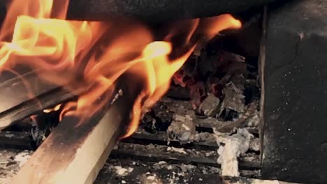 slowmotion view of indian traditional style hand made a fireplace to cook the food with wood - coal etc