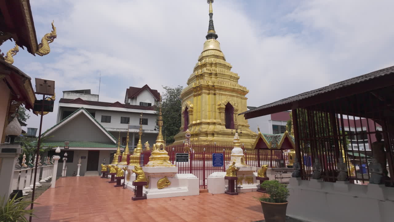 Golden Stupa With Chedis In the Courtyard Of Muen Ngoen Kong Temple In Chiang Mai, Thailand. dolly-in shot