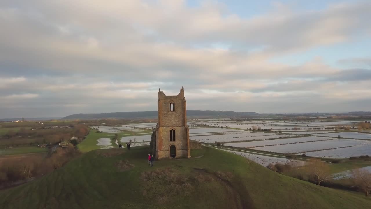 BURROWBRIDGE, SOMERSET, ENGLAND, December 29, 2019: Aerial view of Burrow Mump ruins church with flooded fields on the background.