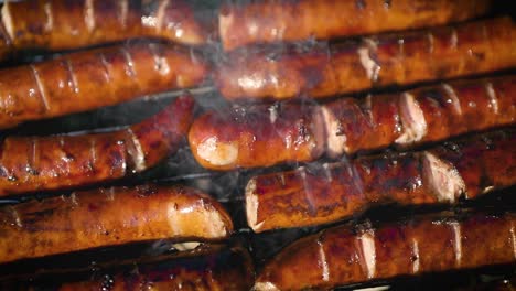 delicious fried sausages on home barbecue