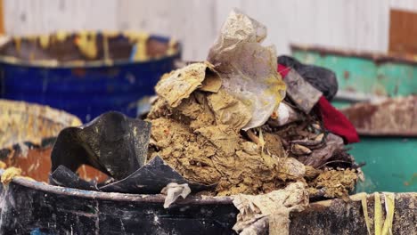 Pile-of-toxic-chemical-waste-in-a-barrel_close-up