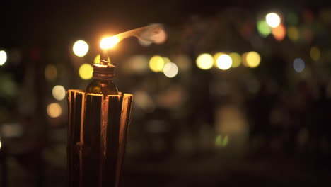 Handheld-shot-of-a-oil-lantern-by-the-beach