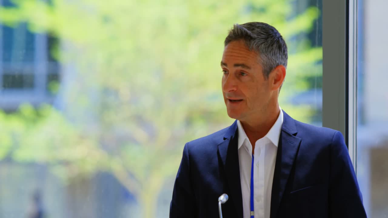 Caucasian male speaker speaks in the business seminar 4k