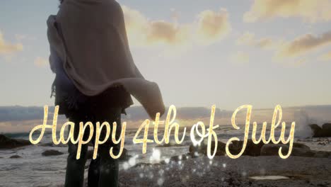 Happy-4th-of-July-greeting-and-couple-by-the-beach-4k