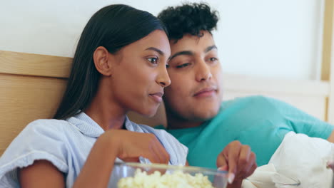 Movie-talk,-bed-and-couple-popcorn-with-laptop